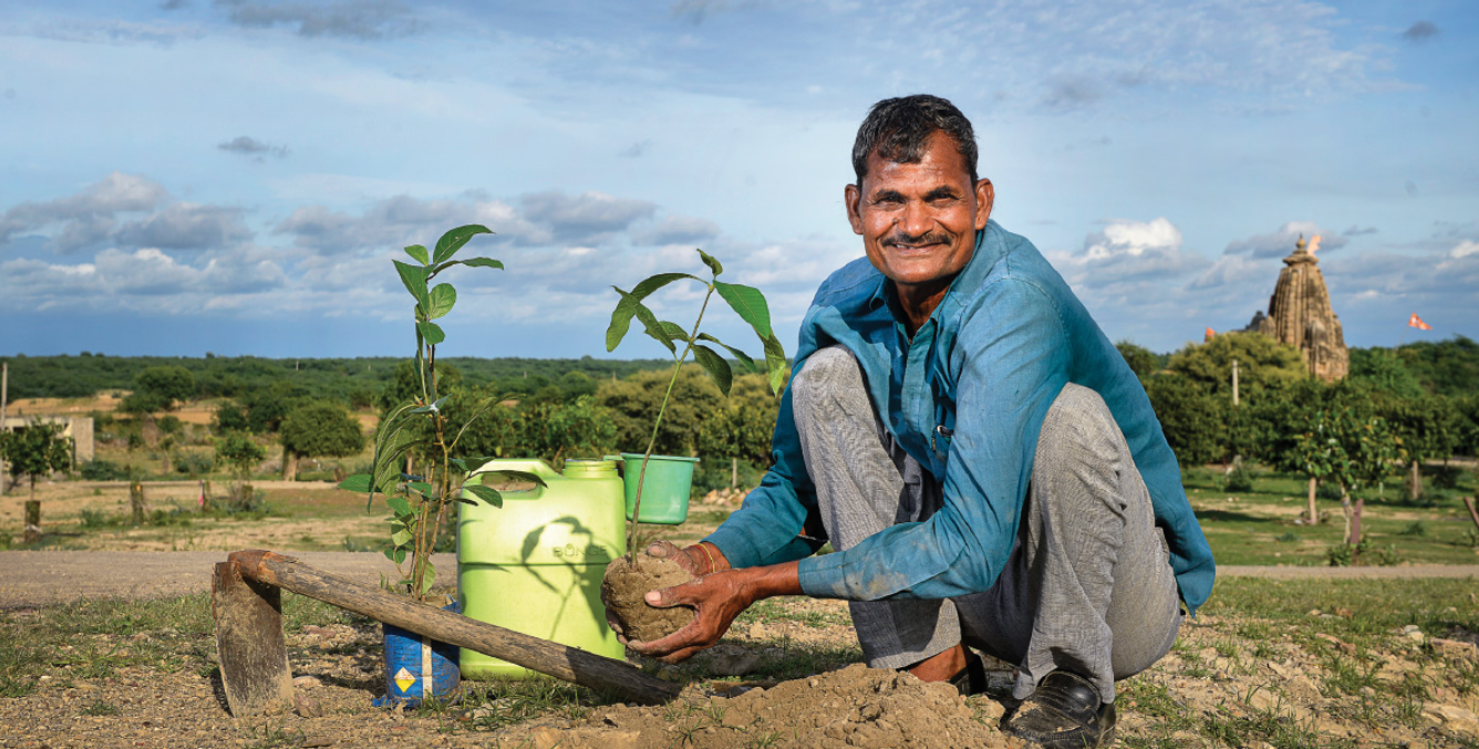 Volunteers planting saplings during Pushp Abhiyaan